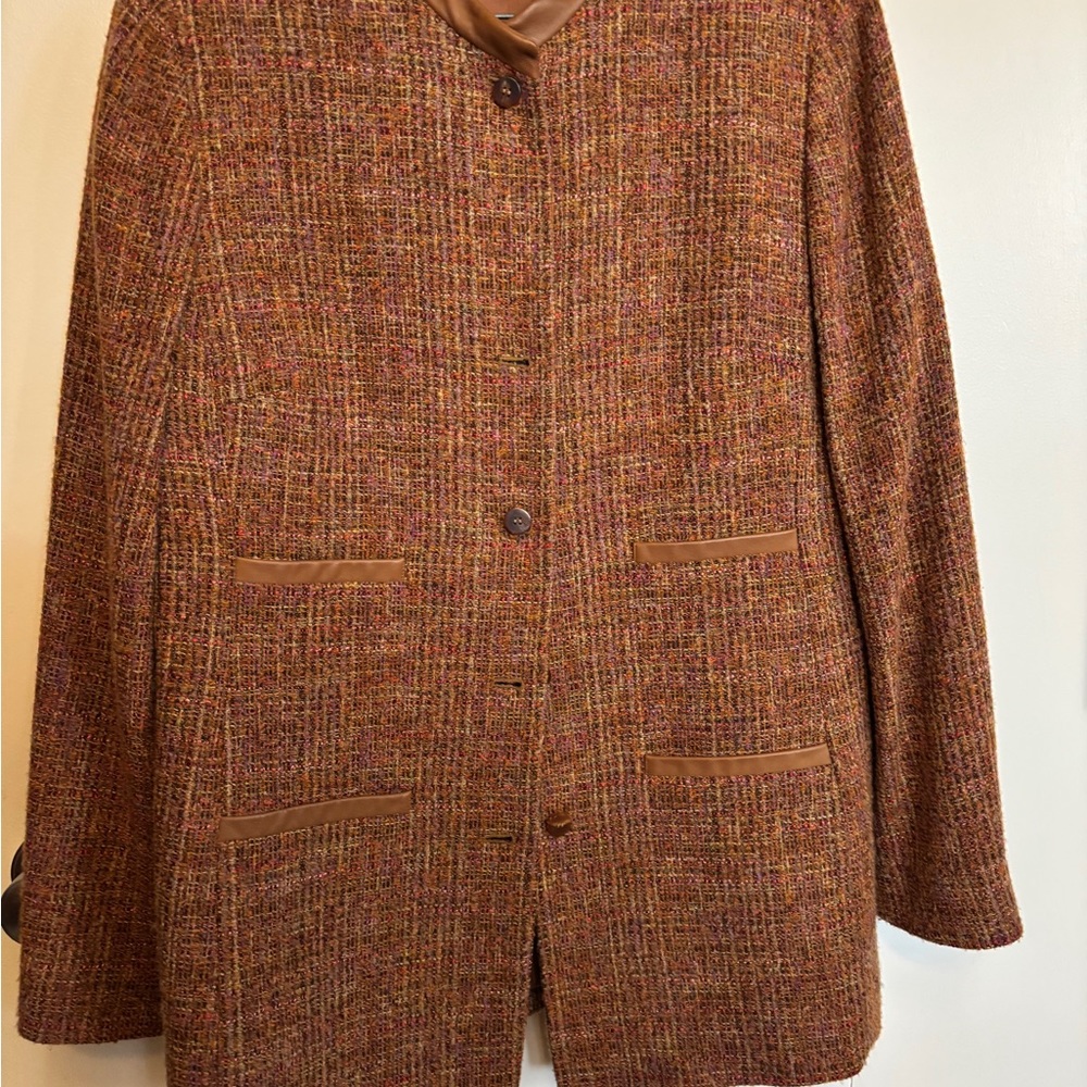 Worth suit with leather skirt and trim.  Size 14.  Excellent condition.